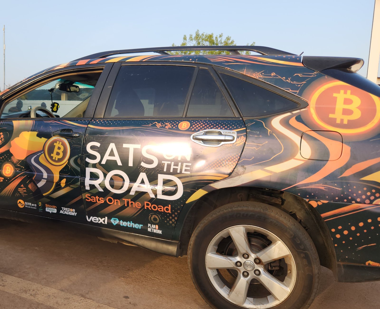 The Sats On The Road vehicle, wrapped in the project livery with partner logos.